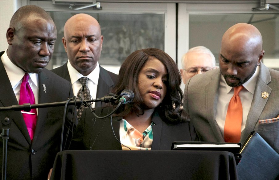 Tiffany Crutcher, the twin sister of Terence Crutcher, speaks during a press conference after her brother's death. She is flanked by attorneys Benjamin Crump, left, and local attorney Damario Solomon-Simmons, right. KASSIE McCLUNG/The Frontier