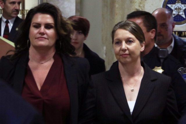 Betty Shelby, right, leaves the courtroom beside her attorney, Shannon McMurray. Shelby was ordered bound over for trial for first-degree manslaughter. DYLAN GOFORTH/The Frontier