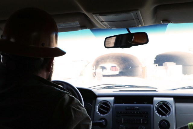 Shane Bevel, left, drives near tunnels within the construction at A Gathering Place For Tulsa. Bevel has spent years documenting the construction of the park. DYLAN GOFORTH/The Frontier