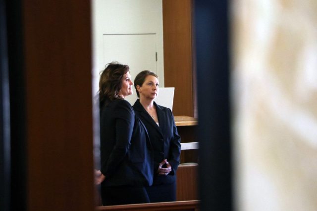 Betty Shelby, right, stands next to her attorney Shannon McMurray during Shelby's preliminary hearing on Tuesday, Nov. 29, 2016. DYLAN GOFORTH/The Frontier